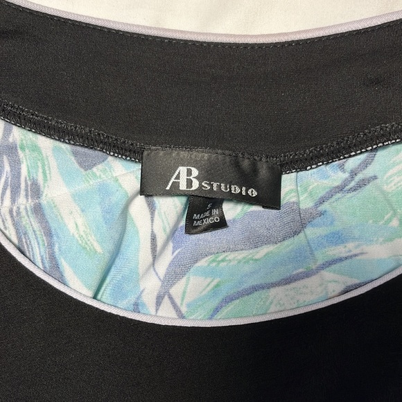 This is a blue abstractly patterned tank top with black trim - Picture 5 of 5